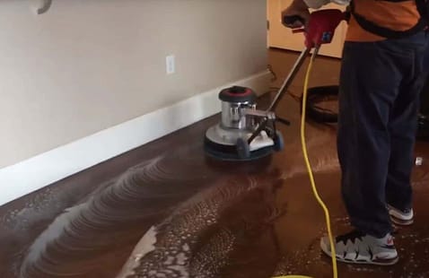 How do I handle heavy stains or discolouration on polished concrete?